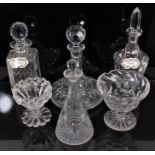 A group of antique cut glassware, including four decanters of various form (two with Halcyon Days en