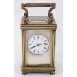 Edwardian brass carriage clock with circular enamel dial