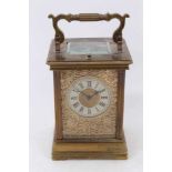 Late 19th century French brass carriage clock with pierced front plate, repeat mechanism