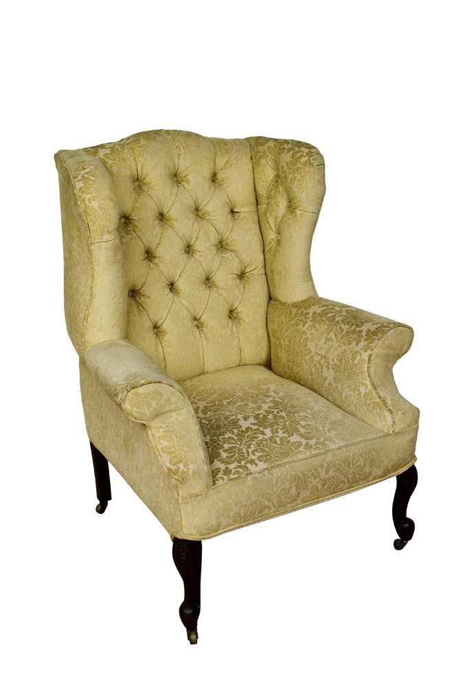 George II style wing armchair, on carved legs and castors