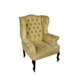 George II style wing armchair, on carved legs and castors