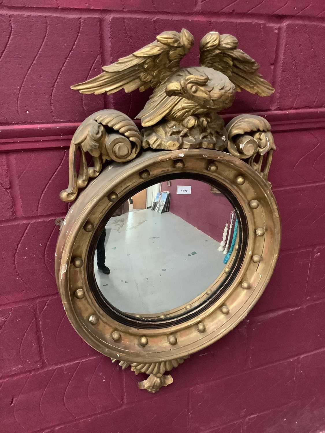 Regency gilt convex wall mirror with eagle cresting