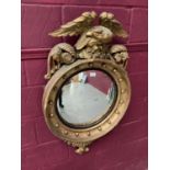 Regency gilt convex wall mirror with eagle cresting