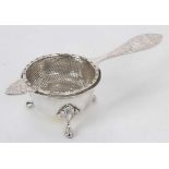 Silver tea strainer and stand