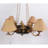 Empire style four branch gilt metal ceiling light, compressed form, applied with floral bosses and a