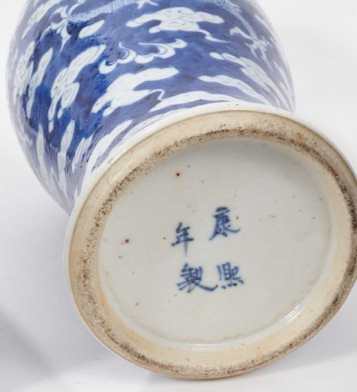A garniture of late 19th century Chinese blue and white porcelain vases, each decorated with dragons - Image 3 of 8