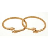 Pair of eastern yellow metal snake bangles