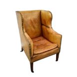 19th century leather upholstered wing armchair