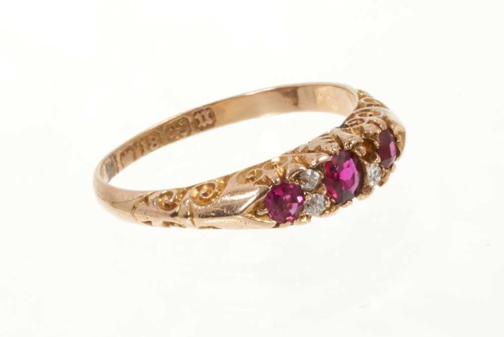 Victorian ruby and diamond ring with three round mixed cut rubies and four old cut diamonds in carve - Image 2 of 3