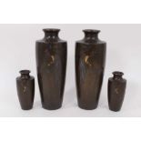 Two pairs of early 20th century Japanese mixed metal slender vases