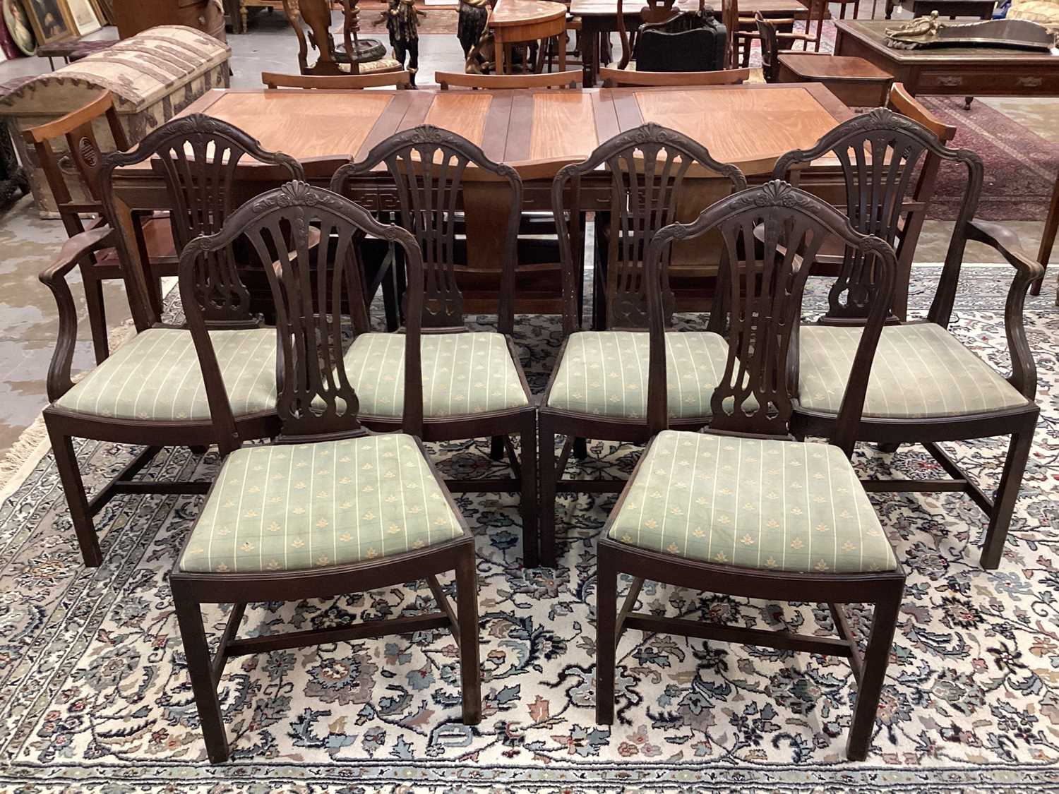 Set of six Hepplewhite style mahogany dining chairs, each with arched pierced splat back and slip in