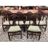 Set of six Hepplewhite style mahogany dining chairs, each with arched pierced splat back and slip in
