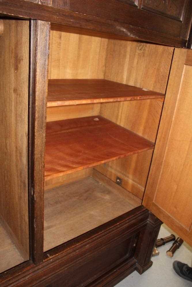 Late 19th / early 20th century Continental carved oak cupboard, enclosed by two pairs of panelled do - Image 7 of 9