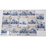Collection of fourteen 18th century Delft blue and white tiles, decorated with buildings and Dutch s