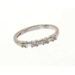Diamond eternity ring with a half hoop of brilliant cut and baguette cut diamonds in 18ct white gold