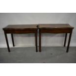 Near pair of George III mahogany serpentine card tables