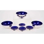 A set of three Danish modernist silver dishes with blue enameled interiors, and four others