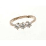Diamond three stone ring with three brilliant cut diamonds in claw setting on 18ct white gold shank