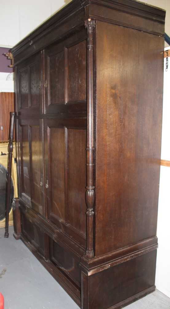 Late 19th / early 20th century Continental carved oak cupboard, enclosed by two pairs of panelled do - Image 8 of 9