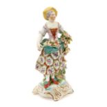 Derby figure of a young girl, with flowers in her apron, circa 1770