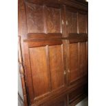 Late 19th / early 20th century Continental carved oak cupboard, enclosed by two pairs of panelled do