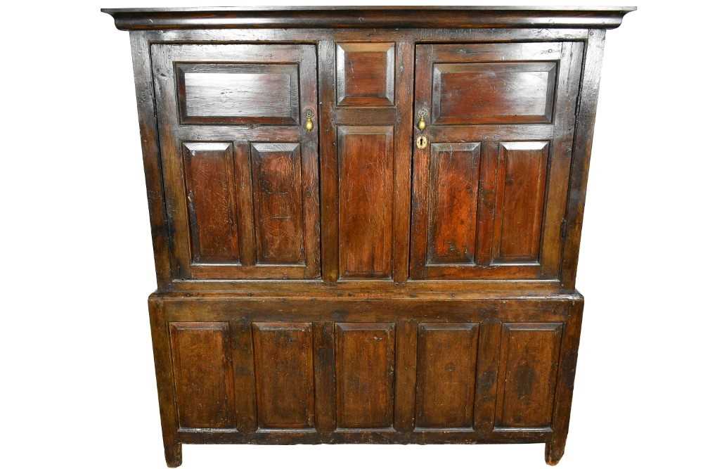 Very large mid 18th century panelled oak and pine two height cupboard