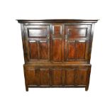 Very large mid 18th century panelled oak and pine two height cupboard