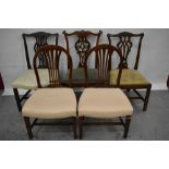 George III carved mahogany dining chair and four others