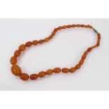 Old graduated amber polished oval bead necklace