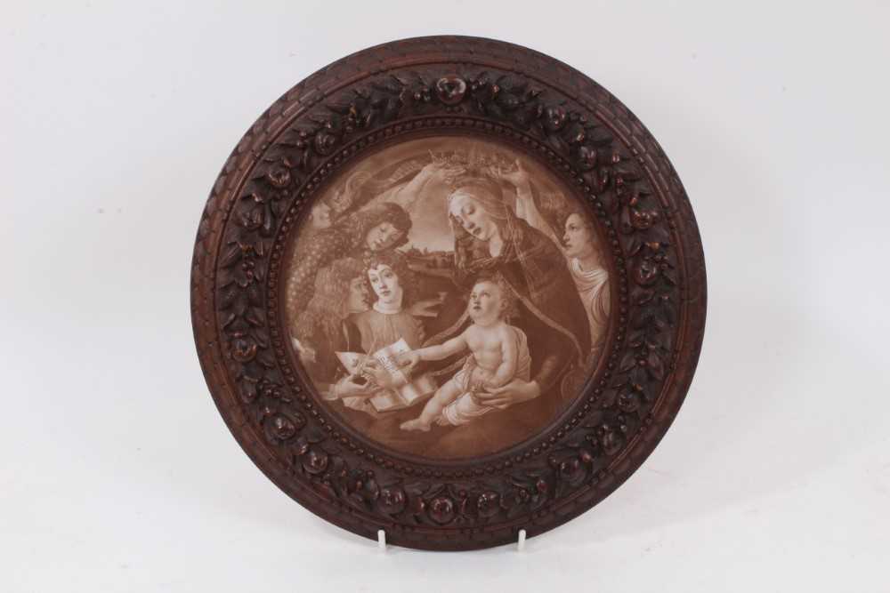 Finely carved 19th century walnut circular frame, carved with fruiting wreath in lambrequin and bead