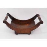 George III oak cheese coaster with turned handles on square base with bun feet