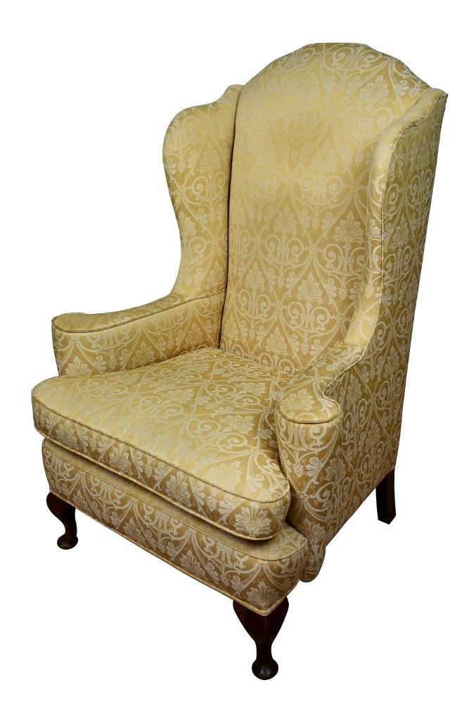 Early 20th century wing armchair with gold upholstery