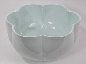A large and finely potted 20th century Japanese celadon glazed porcelain bowl, of six-petal flower f