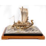 Japanese Takehiko Seki silver treasure ship on silver plated wave base, bearing signature to rudder