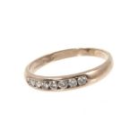 Diamond eternity ring with seven brilliant cut diamonds in 18ct white gold channel setting