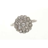 Antique diamond cluster ring with a flower head cluster of pavé set old cut diamonds in platinum set