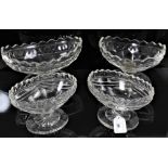 Four 19th century cut glass oval footed dishes with star cut bases, including one pair 17cm wide, an