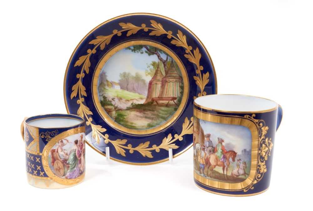 A Sèvres coffee can and saucer, the can decorated with figures on horseback, the saucer with a milit