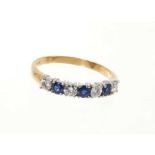 Sapphire and diamond eternity ring with a half hoop of four round brilliant cut diamonds interspaced