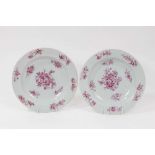 A pair of 18th century Chinese Export plates, painted in puce with flowers