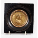 19th century gilt copper medallion depicting Charles X, in ebonised wood frame