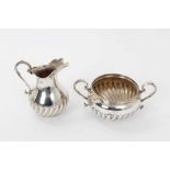 Victorian silver cream jug and sugar basin of spiral fluted baluster form