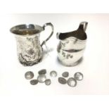 Georgian silver cream jug, Victorian silver christening mug and a ten continental silver buttons