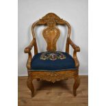 Antique Continental carved beech open armchair with carved splat back and tapestry upholstery on roc
