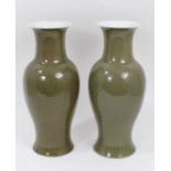 A pair of Chinese dark celadon glazed vases