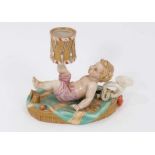 A Royal Worcester chamber candlestick, modelled as a putto with a drum, mark for 1867