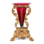 19th century ormolu table centrepiece with ruby glass trumpet, raised on elaborate acanthus supports