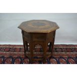 Early 20th century teak and metal inlaid Islamic side table, with octagonal top raised on mihrab pie