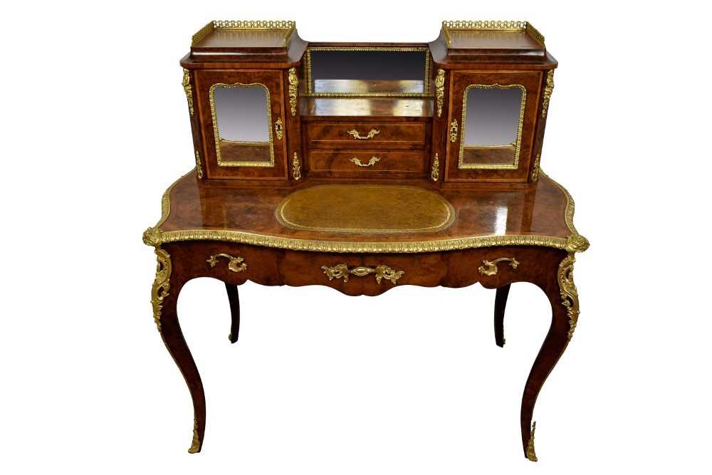 Ornate figured walnut and gilt metal mounted bonheur du jour, pierced galleried superstructure and t