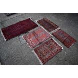 Small Pakistani tekke rug, together with an Eastern prayer rug, near pair of Eastern prayer rugs, an